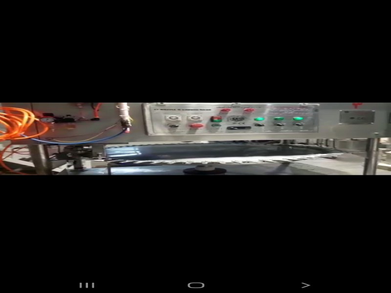 دستگاه پرکن و دربند توان صنعت0